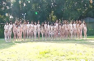 Young Chinese women get filmed in the backstage before taking a naked photoshoot